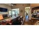 Expansive living area with hardwood floors, a fireplace, and open access to the dining space at 275 Bridgemill Dr, Douglasville, GA 30134