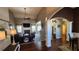 Open-concept living and dining area with hardwood floors, a fireplace, and lots of natural light at 275 Bridgemill Dr, Douglasville, GA 30134