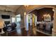 Open-concept living space with hardwood floors, a fireplace, and seamless flow to dining area at 275 Bridgemill Dr, Douglasville, GA 30134