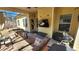 Outdoor covered patio with cushioned seating, a TV, grill and exterior decor at 275 Bridgemill Dr, Douglasville, GA 30134