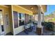 Inviting front porch with rocking chairs and stone pillars, creating a warm welcome at 275 Bridgemill Dr, Douglasville, GA 30134