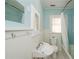 Bathroom features a sink, toilet, bathtub with shower, and a mirror mounted on the wall at 17 Peachtree Ne Ave, Atlanta, GA 30305