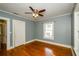 Bedroom with hardwood floors and neutral paint, providing a calming space at 17 Peachtree Ne Ave, Atlanta, GA 30305