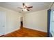 Spacious bedroom with hardwood floors and neutral paint tone, leading to other rooms at 17 Peachtree Ne Ave, Atlanta, GA 30305