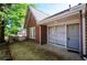 Close-up showcasing the entrance of a charming brick home with a cozy porch at 17 Peachtree Ne Ave, Atlanta, GA 30305