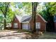 Cozy brick home with mature landscaping and a quaint front entrance at 17 Peachtree Ne Ave, Atlanta, GA 30305