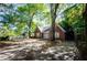 A cozy brick home with a lush yard and mature trees offering shade and privacy at 17 Peachtree Ne Ave, Atlanta, GA 30305