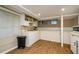 Kitchen featuring white cabinets, and an open shelving unit above the sink at 17 Peachtree Ne Ave, Atlanta, GA 30305
