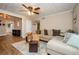 Open-concept living room featuring a sectional sofa, hardwood floors, and plenty of natural light at 17 Peachtree Ne Ave, Atlanta, GA 30305