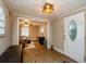 Inviting living room with hardwood floors, neutral walls, open to front door and adjacent room at 17 Peachtree Ne Ave, Atlanta, GA 30305