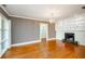 Bright living room features hardwood floors, a fireplace, and recessed lights at 17 Peachtree Ne Ave, Atlanta, GA 30305