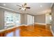 Spacious living room with hardwood flooring, front door and bathroom access at 17 Peachtree Ne Ave, Atlanta, GA 30305