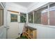 Enclosed porch area with built in storage shelves and an exterior door at 17 Peachtree Ne Ave, Atlanta, GA 30305