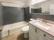 Bathroom featuring tiled walls, neutral countertops, and a shower and bathtub combo at 1793 Witt Cir, Austell, GA 30168