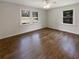 Bedroom featuring neutral colored walls, hardwood floors, and natural lighting at 1793 Witt Cir, Austell, GA 30168