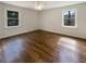 Bedroom featuring neutral colored walls, hardwood floors, and natural lighting at 1793 Witt Cir, Austell, GA 30168
