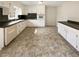 Spacious kitchen with white cabinets, stainless steel appliances, and ample counter space at 1793 Witt Cir, Austell, GA 30168