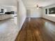 Spacious living area connects to a kitchen with white cabinets and dark countertops at 1793 Witt Cir, Austell, GA 30168