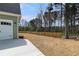 Backyard featuring a well-maintained lawn and a sturdy wooden fence at 529 Claude Scott Rd, Canton, GA 30115