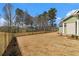 Large backyard surrounded by a sturdy fence offers privacy and security at 529 Claude Scott Rd, Canton, GA 30115