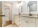 Bathroom with double vanity featuring stone countertops and modern fixtures at 529 Claude Scott Rd, Canton, GA 30115