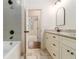Stylish bathroom with tile flooring, dual shower, and vanity with stone countertop at 529 Claude Scott Rd, Canton, GA 30115