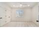 This bedroom offers a ceiling fan and a large window with a view of trees at 529 Claude Scott Rd, Canton, GA 30115