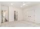 Spacious bedroom featuring neutral carpet, ceiling fan, and ensuite at 529 Claude Scott Rd, Canton, GA 30115