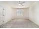 Bedroom with large window, ceiling fan and neutral carpet at 529 Claude Scott Rd, Canton, GA 30115