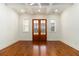 Large bedroom with custom ceiling, hardwood floors, and bright neutral paint at 529 Claude Scott Rd, Canton, GA 30115