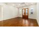 Large bedroom with custom ceiling, hardwood floors, and access to a private patio at 529 Claude Scott Rd, Canton, GA 30115