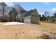 Charming home with a three-car garage and a large front yard at 529 Claude Scott Rd, Canton, GA 30115