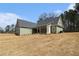Attractive home exterior showcasing a spacious backyard and rear-covered porch at 529 Claude Scott Rd, Canton, GA 30115
