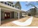 Inviting covered front porch with white columns and a striking wood double-door entrance at 529 Claude Scott Rd, Canton, GA 30115