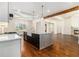 A large marble island is the center of this spacious kitchen with custom cabinetry and open concept design at 529 Claude Scott Rd, Canton, GA 30115