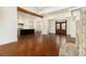 Elegant living room featuring hardwood floors, a stone fireplace, an open floorplan and natural light at 529 Claude Scott Rd, Canton, GA 30115