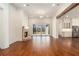 Bright and airy living room featuring hardwood floors, a brick fireplace, and sliding glass doors to the backyard at 529 Claude Scott Rd, Canton, GA 30115