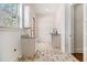 Mud Room with marble countertops and white cabinetry and brick floor at 529 Claude Scott Rd, Canton, GA 30115