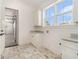 Mud Room with marble countertops and white cabinetry and brick floor at 529 Claude Scott Rd, Canton, GA 30115