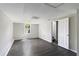 Finished basement with gray wood flooring, white trim, and a window for natural light at 221 Makayla Way, Temple, GA 30179