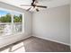 Bedroom with ceiling fan, neutral paint, and a large window at 221 Makayla Way, Temple, GA 30179