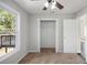 Carpeted bedroom with large closet and bright window at 221 Makayla Way, Temple, GA 30179