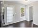 Bright kitchen nook with door to back deck and view to the backyard at 221 Makayla Way, Temple, GA 30179