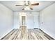 Spacious bedroom with a ceiling fan, wood-look flooring, and access to an adjoining bathroom at 2657 Lenox Ne Rd # 29-1, Atlanta, GA 30324