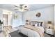 This spacious bedroom has an elegant ceiling fan, wood floors, neutral paint, and ample closet space at 2657 Lenox Ne Rd # 29-1, Atlanta, GA 30324