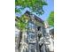 Beautiful condominium building with balcony, and multiple windows and lovely architecture and surrounded by trees at 2657 Lenox Ne Rd # 29-1, Atlanta, GA 30324