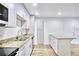 Modern kitchen with white cabinets, granite countertops, stainless steel appliances, and new floors at 2657 Lenox Ne Rd # 29-1, Atlanta, GA 30324