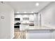 Modern kitchen with white cabinets, granite countertops, stainless steel appliances and island at 2657 Lenox Ne Rd # 29-1, Atlanta, GA 30324