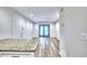 Bright living area with a view of a back patio through sliding glass doors and new floors at 2657 Lenox Ne Rd # 29-1, Atlanta, GA 30324