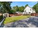 Newly installed backyard with small storage building, patio and manicured lawn at 517 Daniel Ave, Decatur, GA 30032